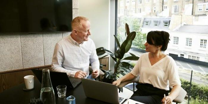 man-and-woman-discussing-and-sharing-ideas-2977565-700x500